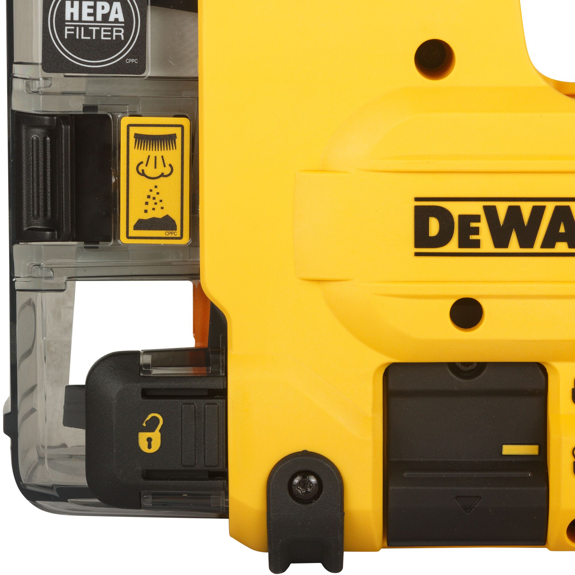 Close-up view of a DEWALT tool, showing a yellow plastic housing with the DEWALT logo, a HEPA filter label, and a warning sticker. The image highlights a locking mechanism and dust extraction feature as part of a photography product in the DEWALT D25304DH range.