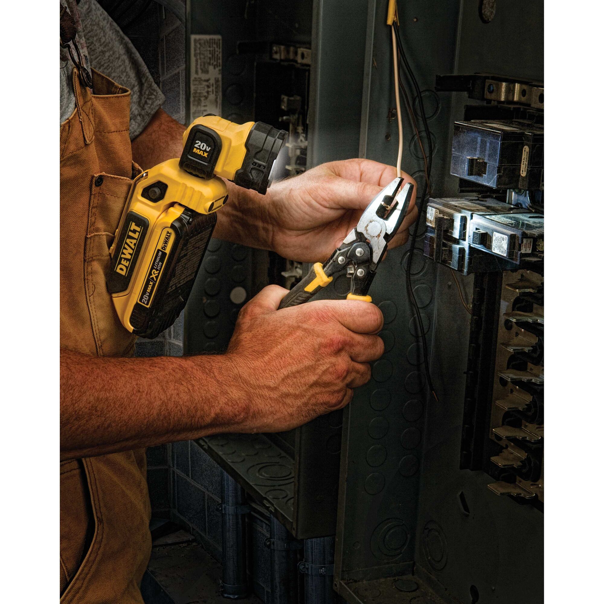 LED hand held worklight being used by a person