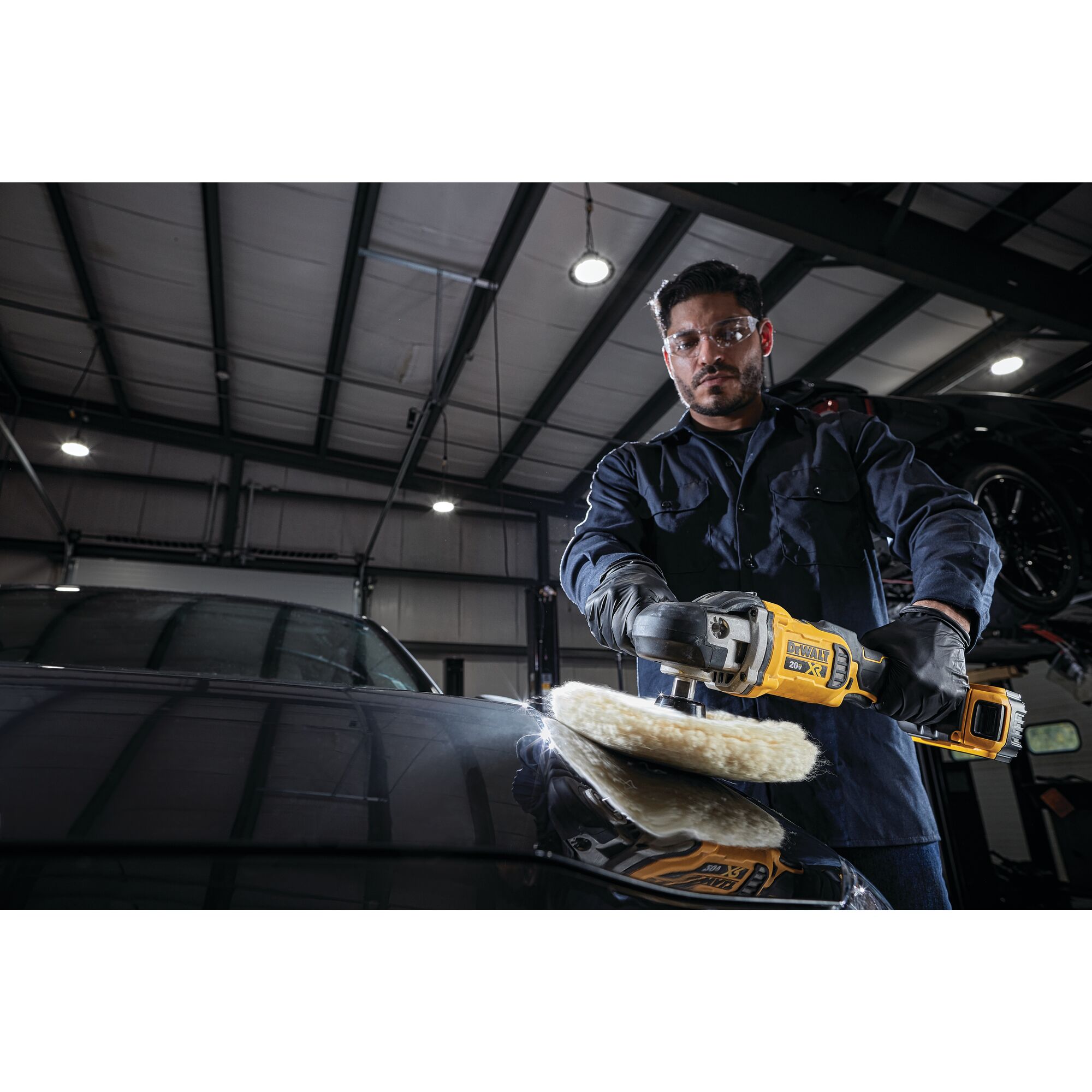 XR cordless variable speed rotary polisher being used by a worker to polish a car