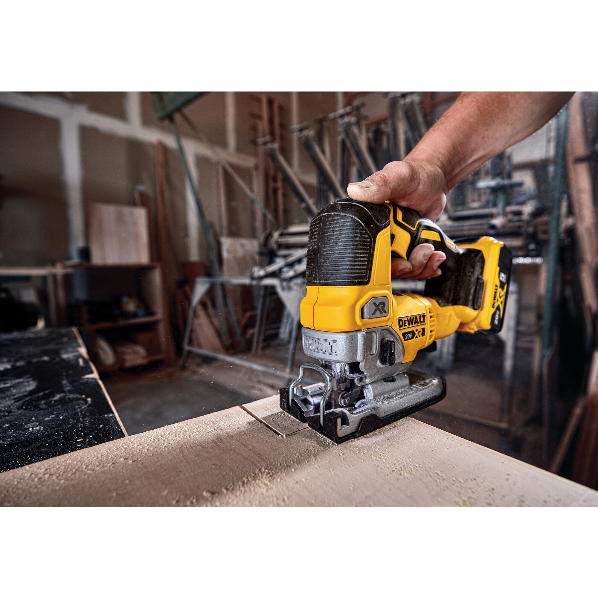 Cordless Jig Saw cutting wood.