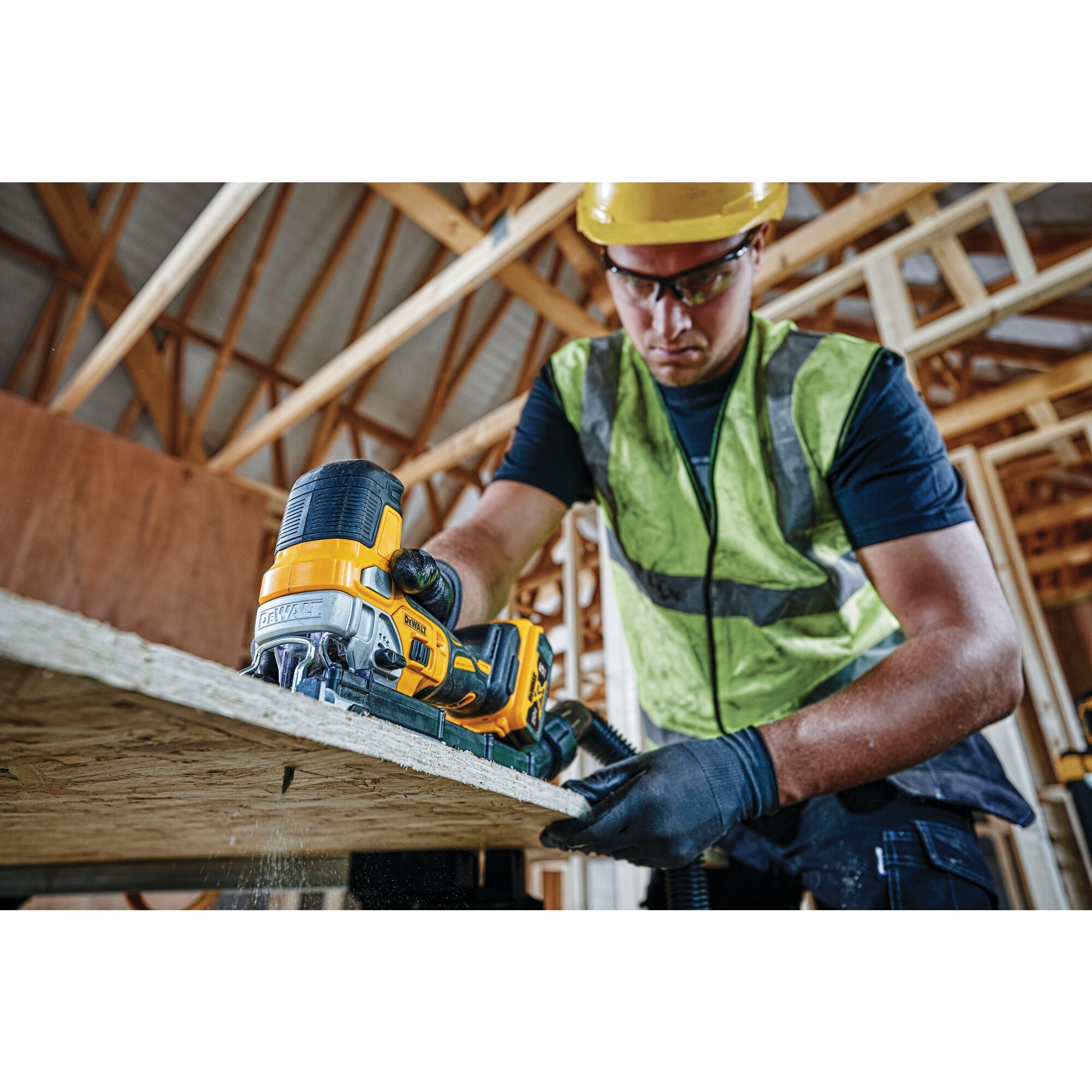 XR Cordless Barrel Grip Jig Saw being used from underneath by worker to cut through a wooden surface at job site