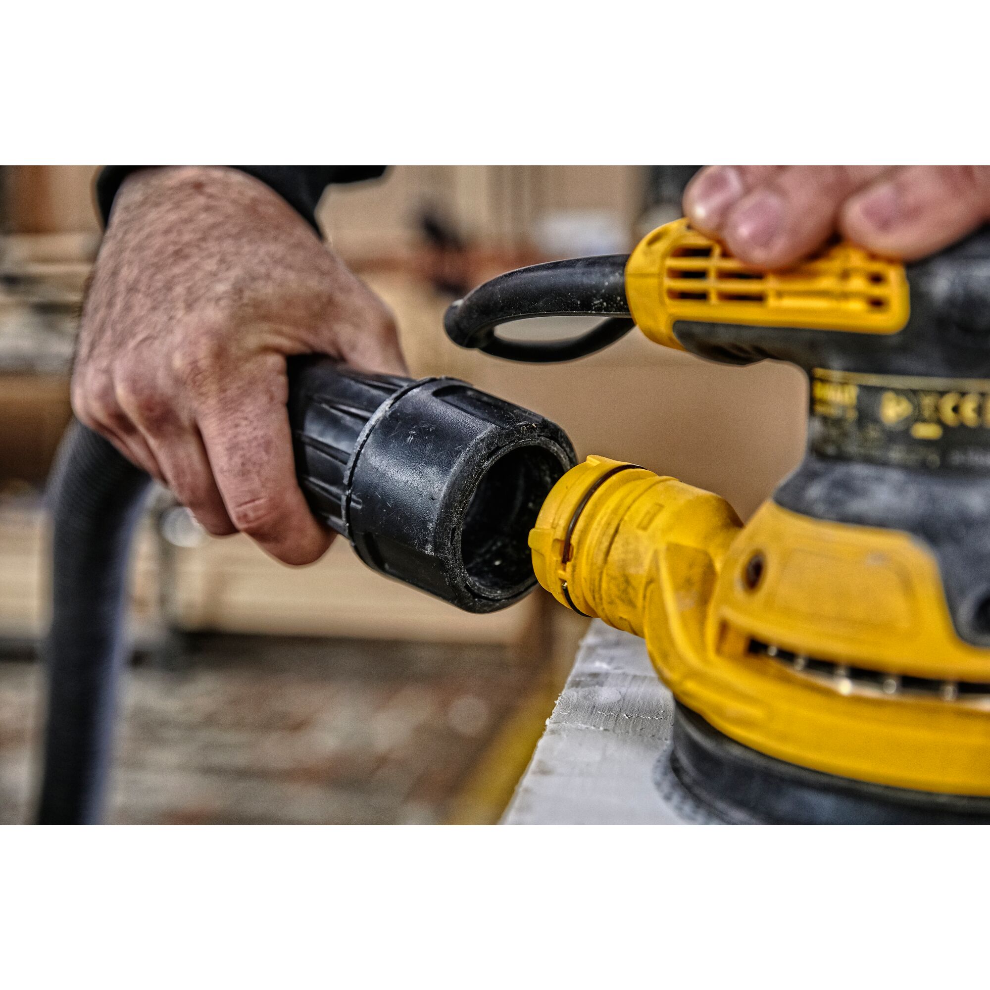 5 inch variable speed random orbit sander sanding a surface.
