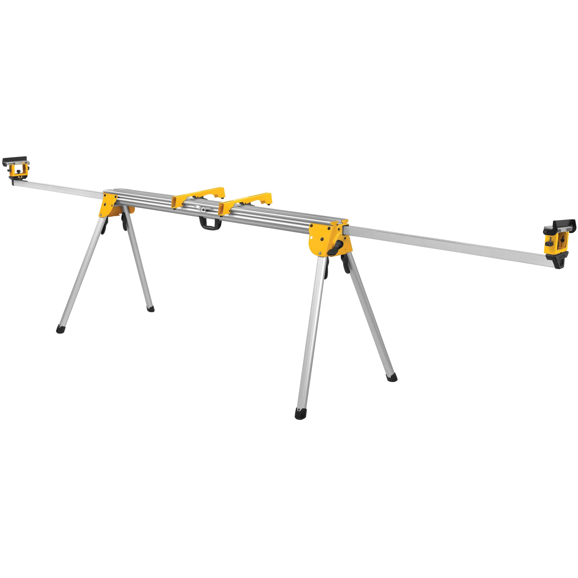 A DEWALT DWX723 aluminum miter saw stand with extendable arms and foldable legs, designed for supporting materials during cutting tasks.